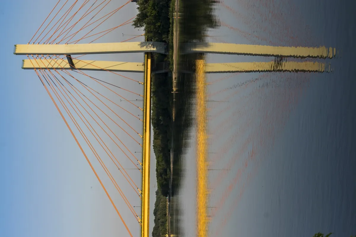 Cable-stayed bridge mirrored symmetrically in still water
